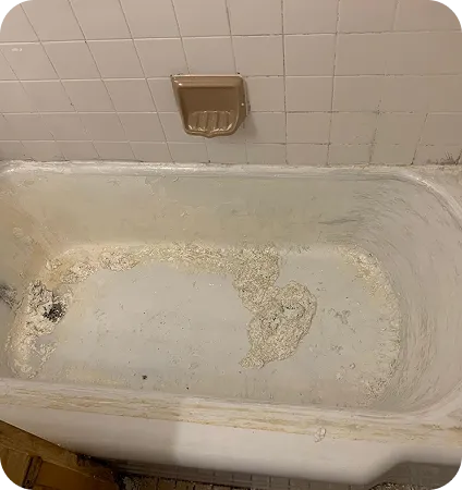 Repairing a chipped and rust-damaged bathtub with professional resurfacing
